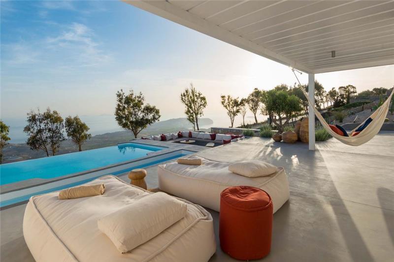 Daybeds above the Aegean at a honeymoon villa